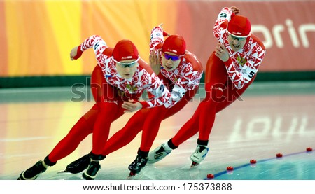 TURIN, ITALY-FEBRUARY 17, 2006: Russian team competing during the Speed Ice Skating competition of the Winter Olympic Games of Turin 2006.