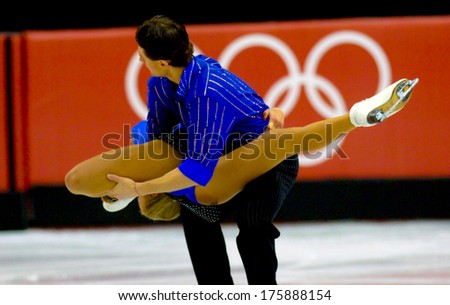 TURIN, ITALY-FEBRUARY 21, 2006: Acrobatic couple while competing on the Figure Ice Skating competition, at the Winter Olympic Games of Turin 2006.