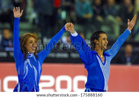 TURIN, ITALY-FEBRUARY 21, 2006: Italian Federica Faiella and Massimo Scali waving the public at the end of the Figure Ice Skating competition, at the Winter Olympic Games of Turin 2006.