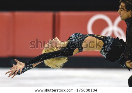 TURIN, ITALY-FEBRUARY 21, 2006: Acrobatic couple ice dancing while competing on the Figure Ice Skating competition, at the Winter Olympic Games of Turin 2006.