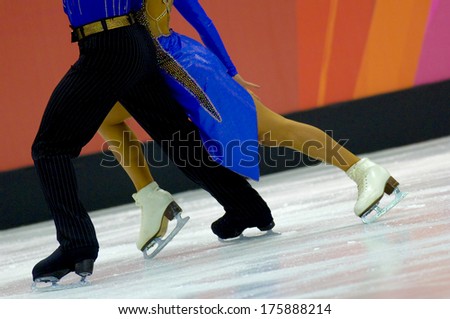 TURIN, ITALY-FEBRUARY 21,2006: Skates close up of a couple competing on the Figure Ice Skating competition, at the Winter Olympic Games of Turin 2006.