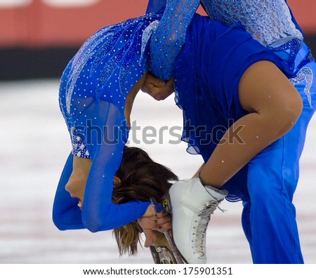 TURIN, ITALY-FEBRUARY 21, 2006: Acrobatic exercise during the Couple Figure Ice Skating competition of the winter Olympic Games of Turin 2006.