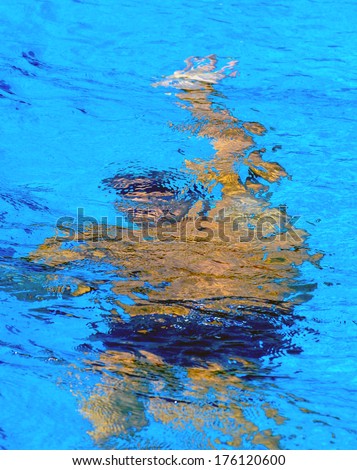 BUDAPEST-HUNGARY-JULY 31 2006: Professional male swimmer diving into water during a backstroke race of the European Swimming Championship in Budapest.