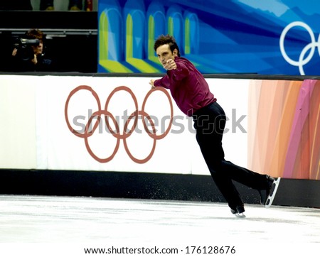 TURIN, ITALY-FEBRUARY 15, 2006: Stephane Lambiel competes during the Individual Male Figure Ice Skating competition at the Winter Olympic Games of Turin 2006.
