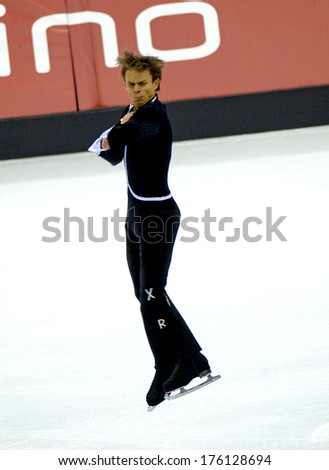 TURIN, ITALY-FEBRUARY 15, 2006: ivan Dinev competes during the Individual Male Figure Ice Skating competition at the Winter Olympic Games of Turin 2006.