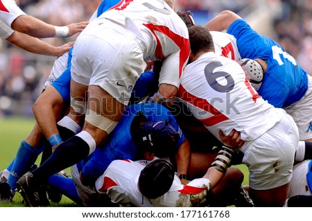 LONDON, ENGLAND-MARCH 27, 2007: Rugby players scrum during the Six Nations Tournament match England vs Italy.