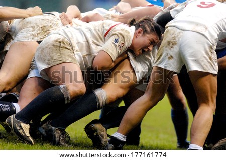 LONDON, ENGLAND-MARCH 26, 2007: Female rugby players scrum during the Six Nations Tournament match England vs Italy.