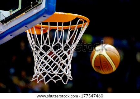 MILAN, ITALY-NOVEMBER 15, 2006: Basket ball entering the hoop during a professional match of the Italian Basketball League.