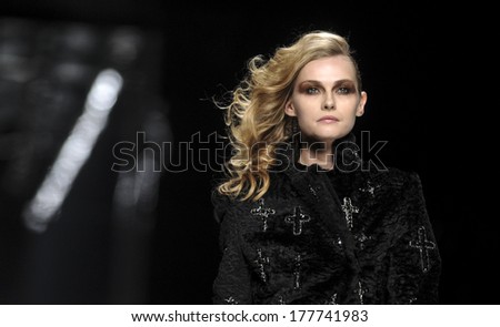 MILAN, ITALY-FEBRUARY 27, 2010: Model looking forward on runway catwalk during the spring-summer fashion collection of John Richmond.