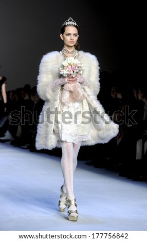 MILAN, ITALY-FEBRUARY 25, 2010: Model wearing a bride dress on runway catwalk during the fall-winter fashion collection of Blugirl.