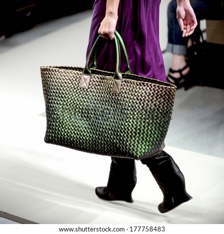 Milan, Italy-February 27, 2010: Close Up Of A Model\'S Green Bag On Runway Catwalk During The Fall-Winter Fashion Collection Of Bottega Veneta.
