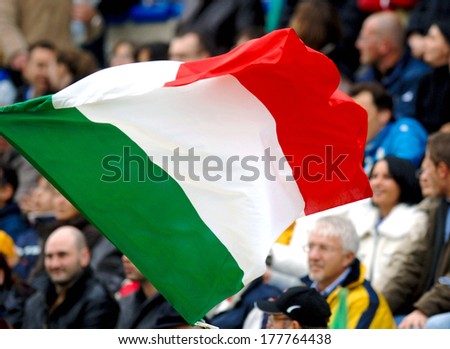 ROME, ITALY-december 13, 2006: Italian flag waved by supporters at the Flaminio stadium during an official Rugby Test Match of the Italian team.
