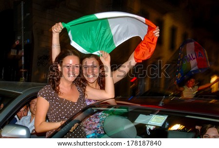 MILAN, ITALY-JULY 05, 2006: Italian soccer fans celebrating at night on the streets of Milan the Italian win of the soccer World Cup of Germany 2006.