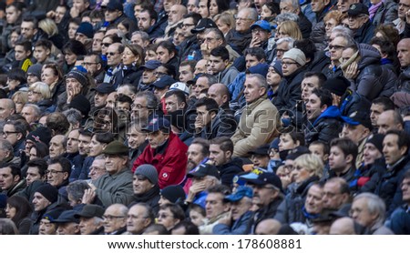 MILAN, ITALY-FEBRUARY 23, 2014: Soccer stadium fans watching an italian soccer match at the San Siro stadium.