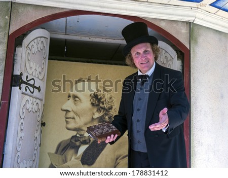 ODENSE, DENMARK-FEBRUARY 16, 2012: Actor playing the role fairytale's writer Hans Christian Andersen, inside the amusement park family of the writer museum.