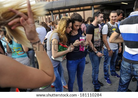MILAN, ITALY-JUNE 20, 2012: College students before entering at school for the secondary school\'s final exams, at the Artemisia Gentileschi School in Milan.