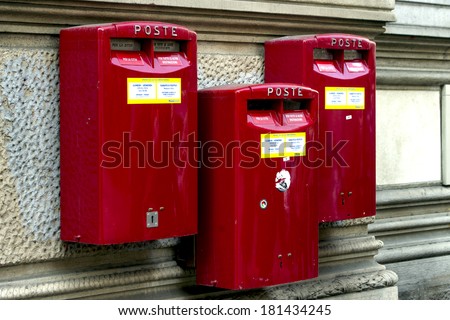 MILAN, ITALY-FEBRUARY 22, 2012: Red mail boxes outside a post office in Milan.