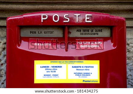 MILAN, ITALY-FEBRUARY 22, 2012: Red mail box outside a post office in Milan.