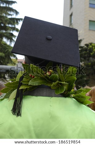 MILAN, ITALY-JANUARY 12, 2012: A student of the Bocconi University, wears the graduation cap and the laurel crown, during the graduation day, in Milan.