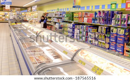 VARESE, ITALY-APRIL 11, 2014: Frozen food refrigerator in a supermarket aisle, in Varese.