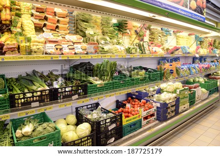 VARESE, ITALY-APRIL 11, 2014: Vegetables and packaged food in a supermarket shelve, in Varese.