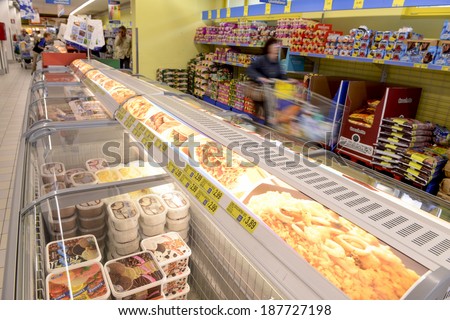VARESE, ITALY-APRIL 11, 2014: Refrigerator for frozen food in a supermarket, in Varese.