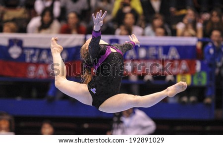 MILAN, ITALY-APRIL 02, 2009: a female gymnast playing floor exercise, during the European Artistic Gymnastic Championship, in Milan.