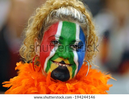 PARIS, FRANCE-OCTOBER 15, 2007: South African supporter woman, with national colors masked face,before the rugby match Argentina vs South Africa of the Rugby World Cup, in Paris.