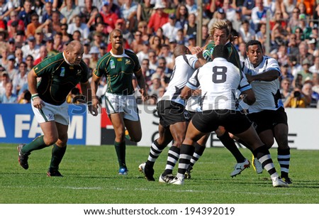 MARSEILLE, FRANCE-OCTOBER 07, 2007: Percy Montgomery of South Africa, stopped by fijians defense players, during the match Fiji vs South Africa, of the Rugby World Cup France 2007, in Marseille.