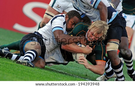 MARSEILLE, FRANCE-OCTOBER 07, 2007: rugby player Schalk Burger of South Africa, stopped by fijian defense during the match Fiji vs South Africa, of the Rugby World Cup France 2007, in Marseille.