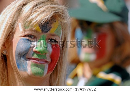 MARSEILLE, FRANCE-OCTOBER 07, 2007: masked face South African supporter girls cheering during the match Fiji vs South Africa, of the Rugby World Cup France 2007, in Marseille.
