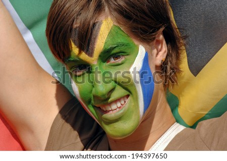 MARSEILLE, FRANCE-OCTOBER 07, 2007: masked face South African supporter girl cheering during the match Fiji vs South Africa, of the Rugby World Cup France 2007, in Marseille.
