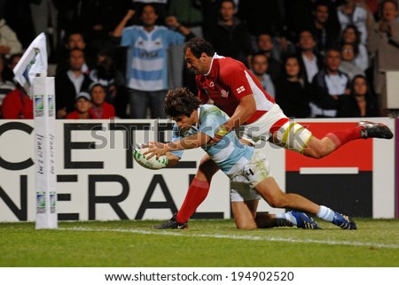 LYON, FRANCE-SEPTEMBER 12, 2007: argentinian rugby player, Lucas Borges, scores a try, during the rugby match Argentina vs Georgia, of the Rugby World Cup, France 2007, in Lyon.