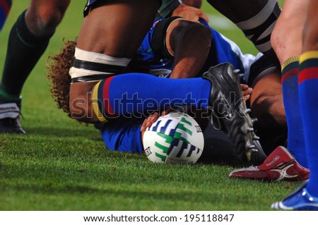 BORDEAUX, FRANCE-SEPTEMBER 09, 2007: the oval ball is seen through a scrum, during the match Ireland vs Namibia, of the Rugby World Cup, France 2007, in Bordeaux.