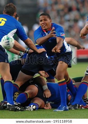BORDEAUX, FRANCE-SEPTEMBER 09, 2007: namibian player, Eugene Juantjies, throws the ball during the match Ireland vs Namibia, of the Rugby World Cup, France 2007, in Bordeaux.
