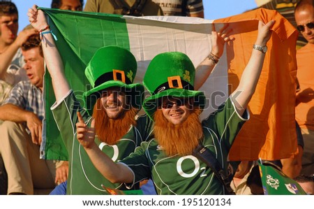 BORDEAUX, FRANCE-SEPTEMBER 09, 2007: irish fans cheering with the national flag during the match Ireland vs Namibia, of the Rugby World Cup, France 2007, in Bordeaux.