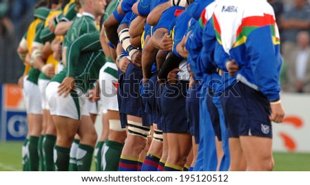 BORDEAUX, FRANCE-SEPTEMBER 09, 2007: players embracing during the national anthem, before the match Ireland vs Namibia, of the Rugby World Cup, France 2007, in Bordeaux.