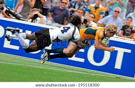 MONTPELLIER, FRANCE-SEPTEMBER 23, 2007: australian rugby player, Drew Mitchell, scores a try during the match Australia vs Fiji, at the Rugby World Cup, France 2007, in Montpellier.