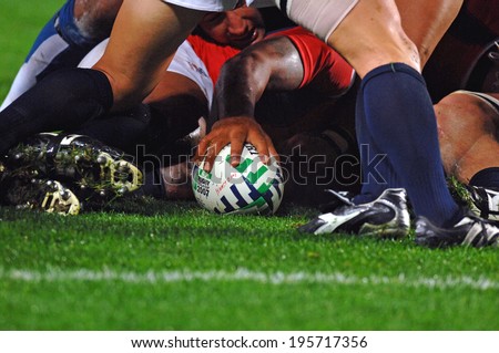 SAINT-ETIENNE, FRANCE-SEPTEMBER 27, 2007: rugby player holds the balls in a scrum, during the rugby match USA vs Samoa, of the Rugby World Cup, France 2007, in Saint-Etienne.