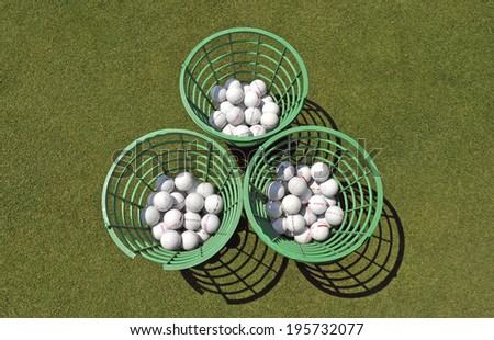 MILAN, ITALY-MAY 28, 2014: plastic baskets with golf balls on the green, of the San Siro Golf Club, in Milan.