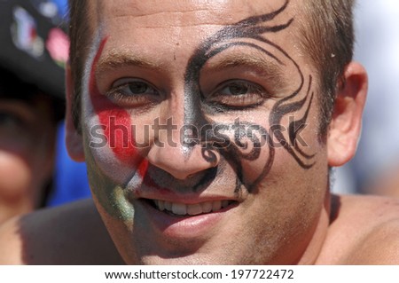 MARSEILLE, FRANCE-SEPTEMBER 08, 2007: rugby fan with masked face of both team colors, during the rugby match Italy vs New Zealand, during the Rugby World Cup of France 2007, in Marseille.