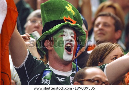 PARIS, FRANCE-SEPTEMBER 22, 2007: irish fan cheering with masked face, during the Rugby World Cup match, Ireland vs France, in Paris.