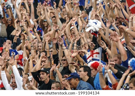 MARSEILLE, FRANCE-SEPTEMBER 30, 2007: rugby fans cheering during the Rugby World Cup match France vs Georgia, in Marseille.
