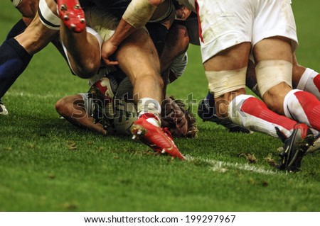 PARIS, FRANCE-OCTOBER 14, 2007: english and french rugby players pushing in scrum, during the match France vs England, of the Rugby World Cup, in Paris.