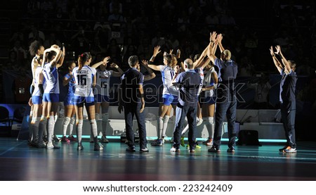 MILAN, ITALY-OCTOBER 10, 2014: italian team players giving high five before the indoor female volleyball match Italy vs Russia during the Volleyball World Cup, in Milan.