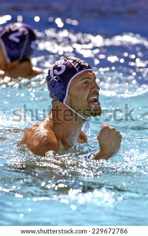 BARCELONA, SPAIN-JULY 16, 2003: italian water polo player Andrea Mangiante celebrates after scored during the World Water Polo Championship, in Barcelona.
