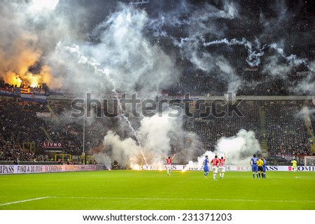 MILAN, ITALY-NOVEMBER 16, 2014: smoke bombs thrown by croatian fans into the san siro soccer field, during the international soccer match Italy vs Croatia, in Milan.