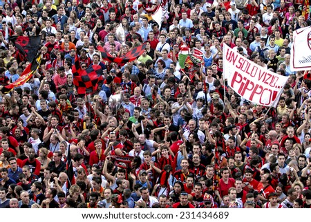 MILAN, ITALY-FEBRUARY 13, 2006: AC Milan soccer fans gathering in Duomo square to celebrate the winning of the UEFA Champions League, in Milan.