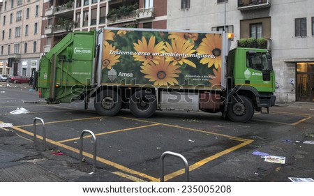 MILAN, ITALY-DECEMBER 02, 2014: garbage truck cleaning after a street market, in Milan.