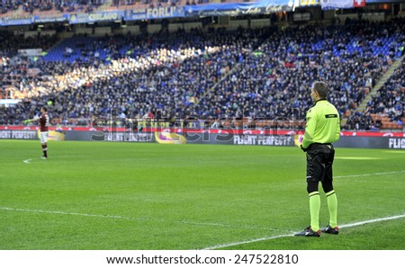 MILAN, ITALY-JANUARY 25, 2015: assistant referee stand on the soccer field line at the san siro stadium for the serie A match FC Internazionale vs Torino, in Milan.